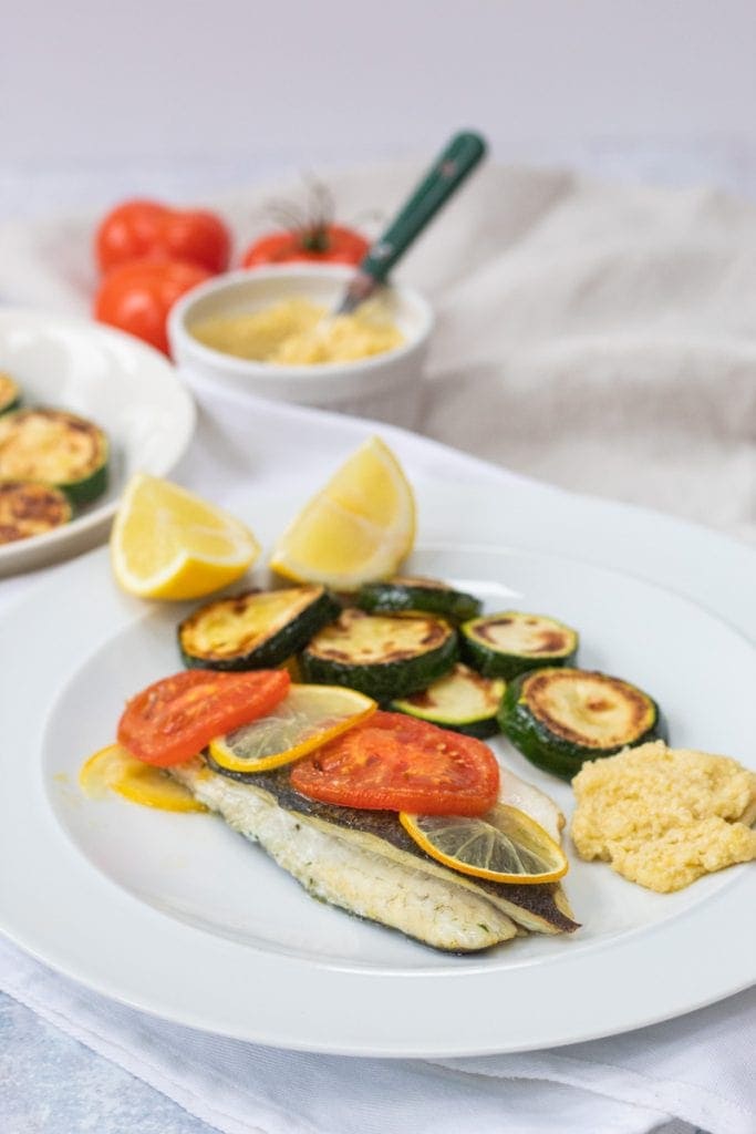 Sea bass on a plate with tarator sauce