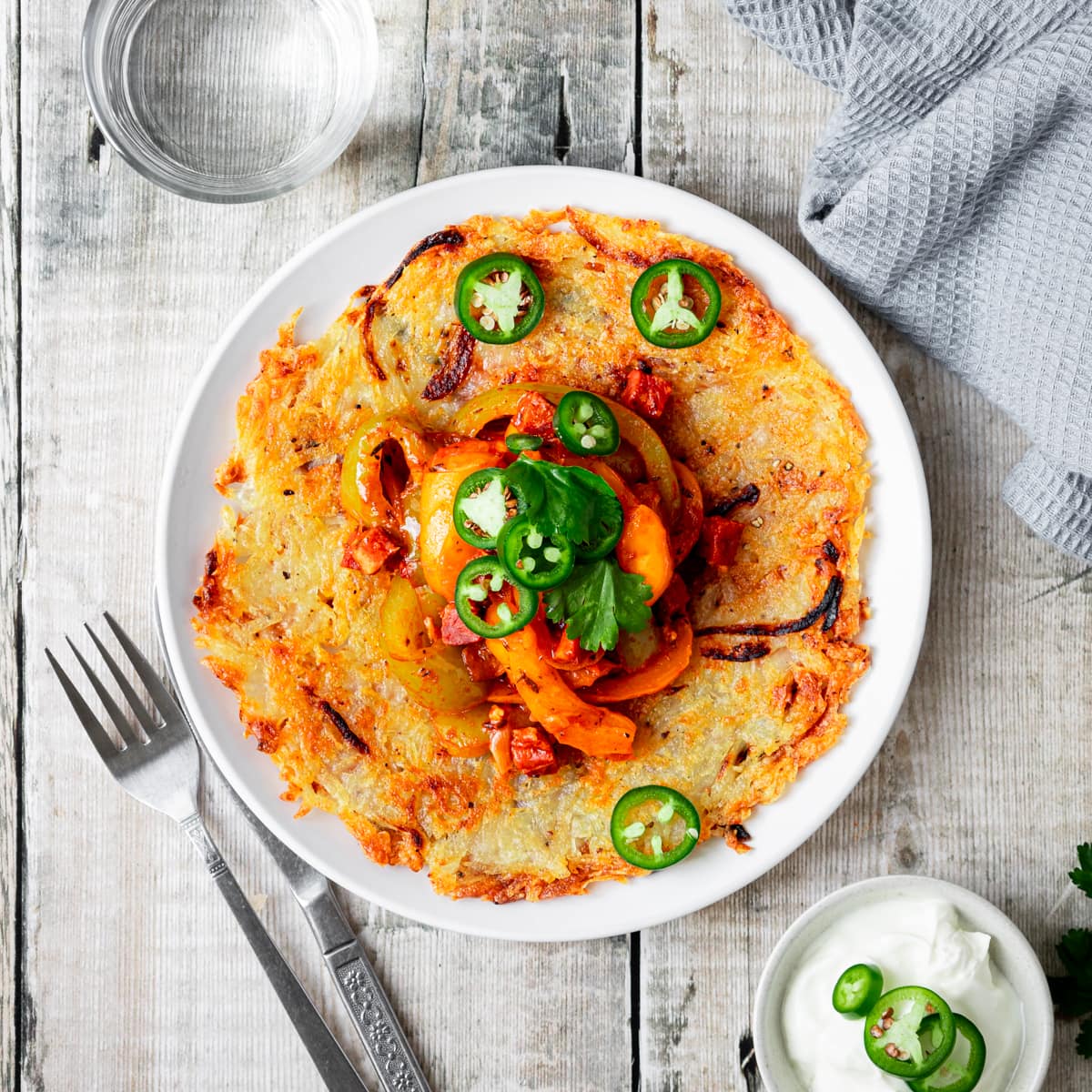 potato rosti topped with chorizo and pepper ragout