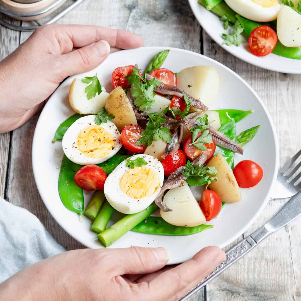 Plate of no mayo potato egg and anchovy salad