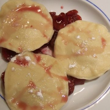 Chocolate ravioli with cherry sauce