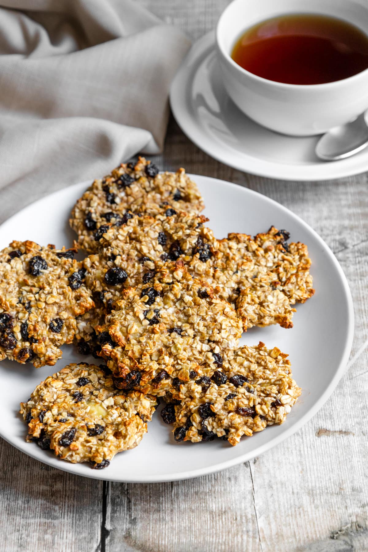 banana oat raisin cookies with cup of tea