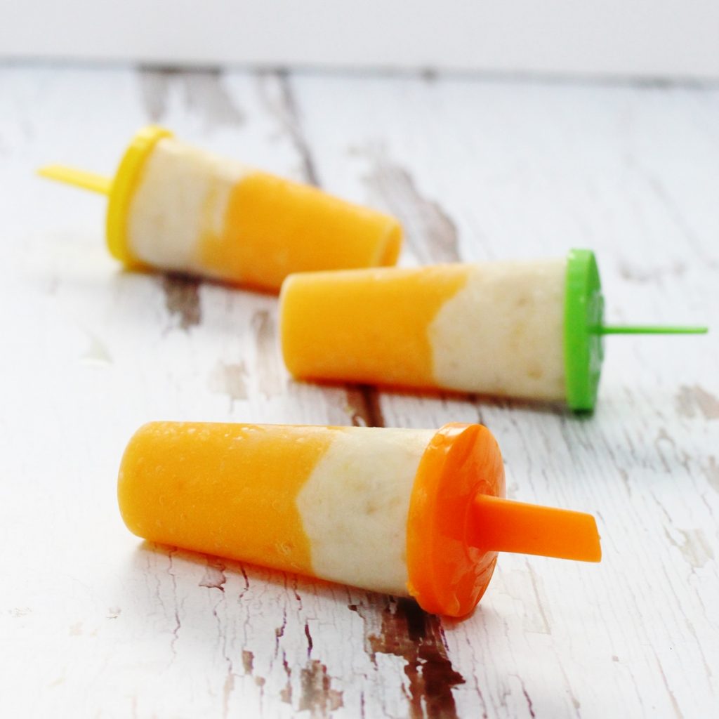 homemade popsicles made with pureed banana and yogurt and peach