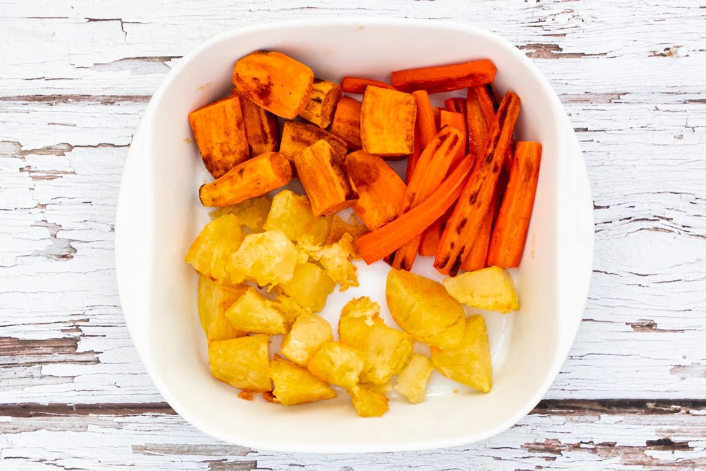 bowl or roasted vegetables - potatoes, carrots and sweet potatoes