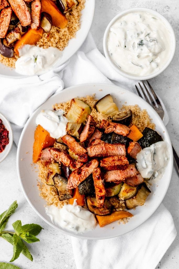 plates of harissa marinated lamb salad