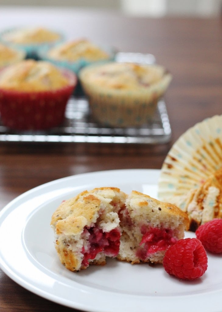 Lemon Raspberry and Chia Seed Muffin on a plate with muffins in the background