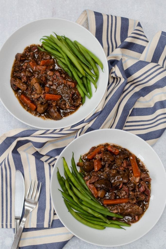 two bowls of slow cooker beef bourguignon
