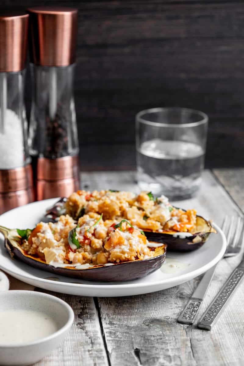 stuffed aubergine with salt and pepper pots in the background