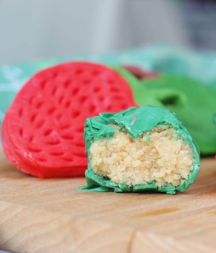 Close up of bite taken out of Hungry Caterpillar cake ball