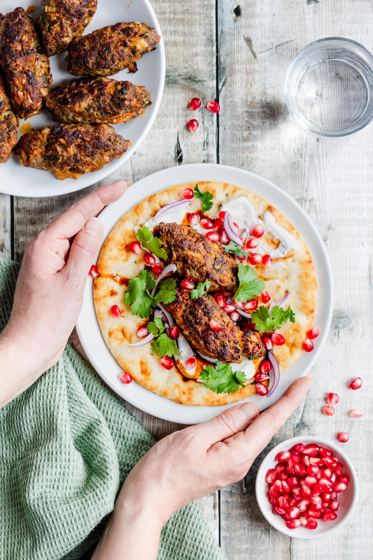Geogrian lamb kebabs with hands holding plate