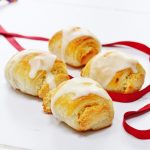 4 almond rolls with red ribbon
