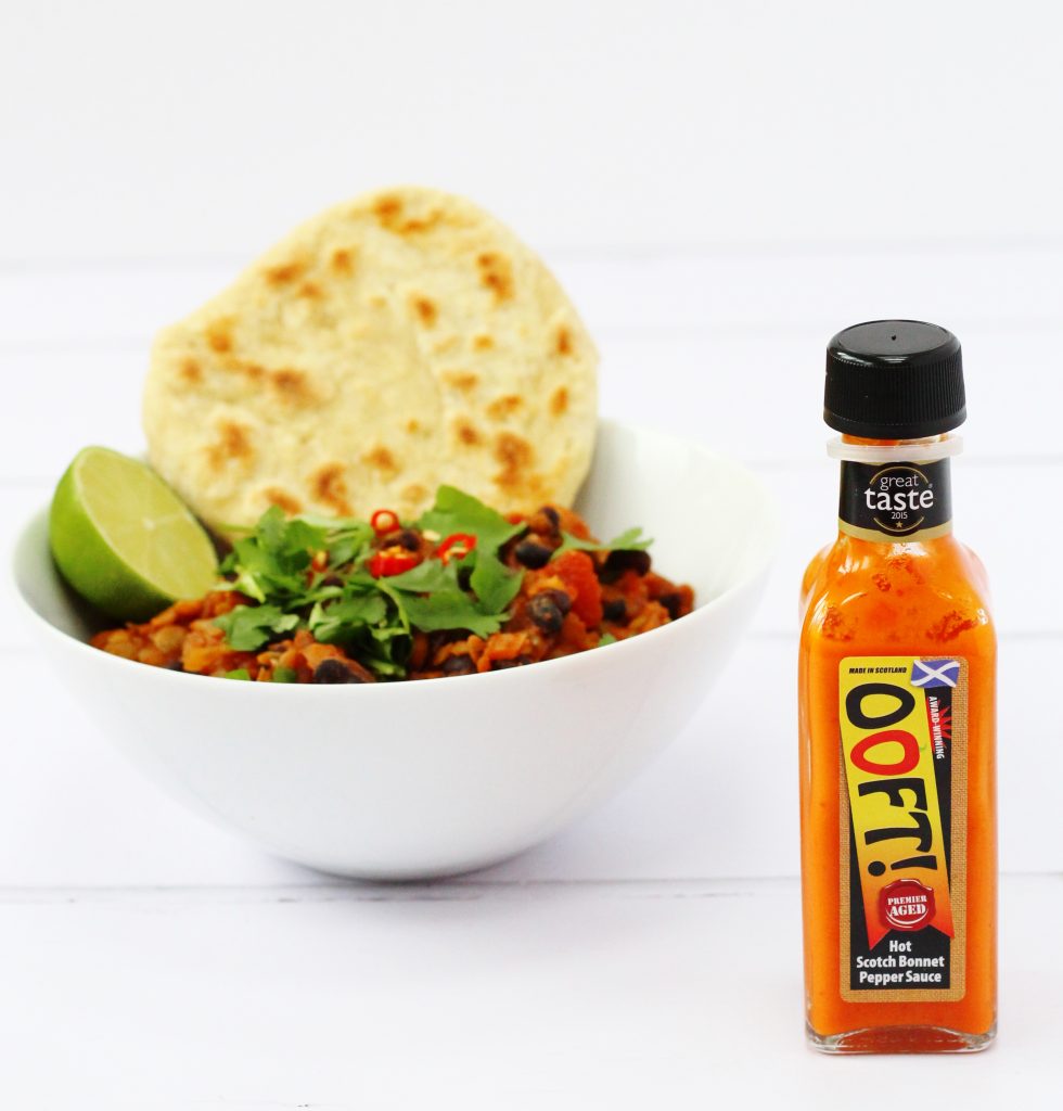 Ooft hot sauce and bowl of vegan lentil chilli.