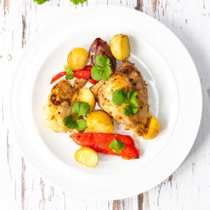 plate of ras el hanout chicken tray bake