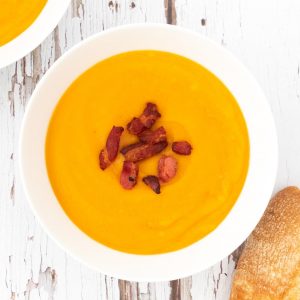 Leftover roasted vegetable soup topped with bacon