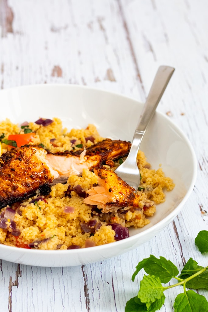 Moroccan spiced salmon with ras el hanout on top of couscous