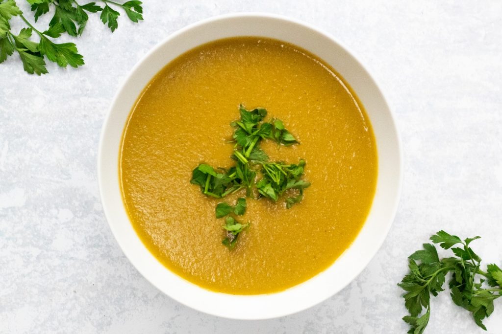 white bowl of leek and potato soup