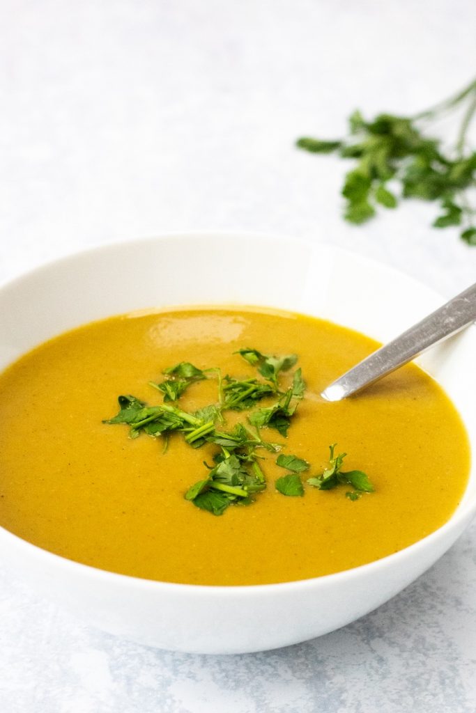 spiced leek and potato soup in a white bowl