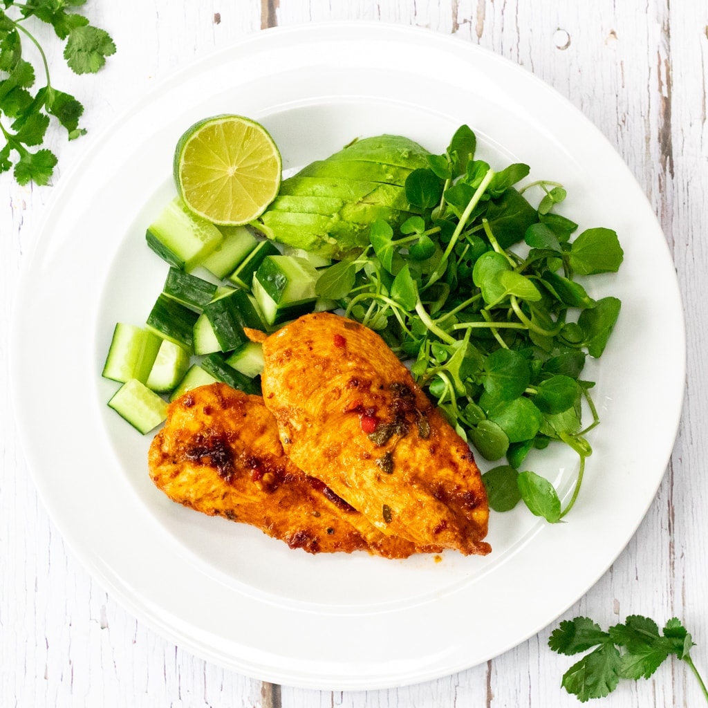 Chipotle lime chicken on a plate with salad