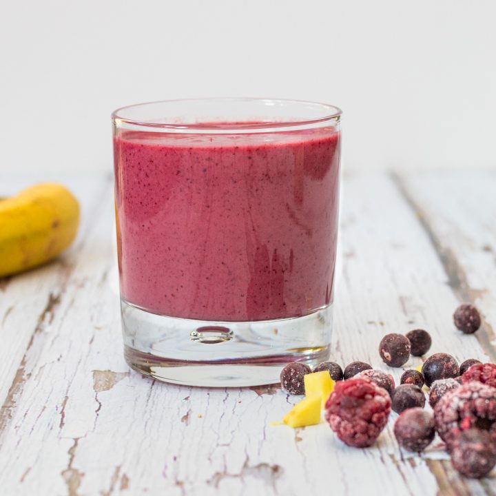 red berry smoothie in a glass