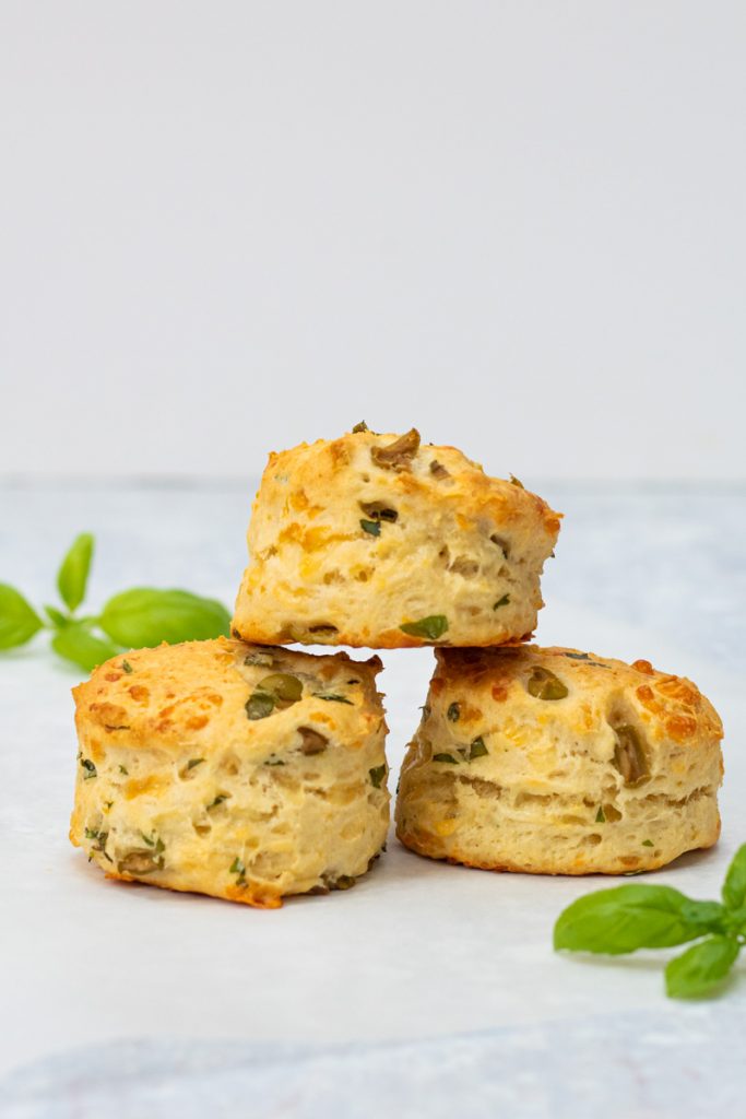 three cheese and olive scones stacked on top of each other