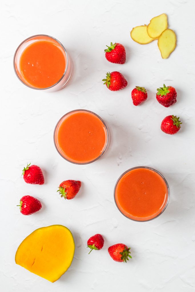 flatlay of strawberry mango smoothie with ingredients
