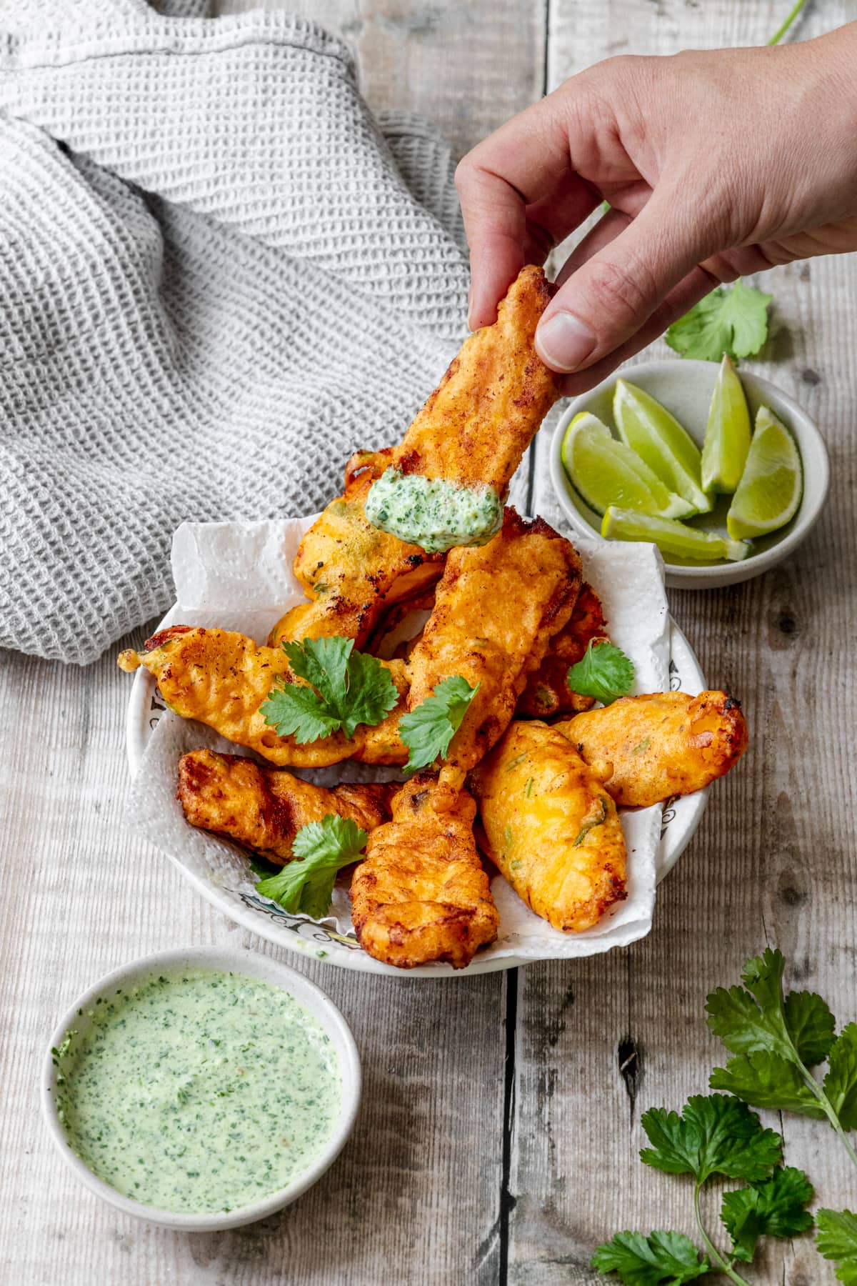 hand taking a fish pakora