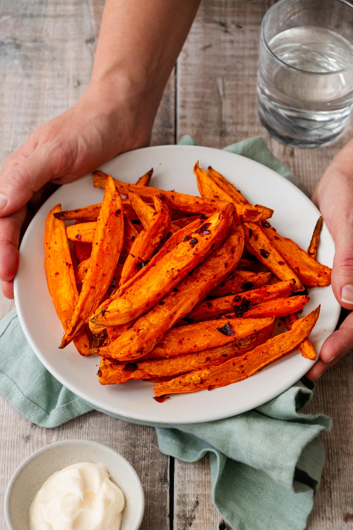 Plate of air fried harissa sweet potato wedges