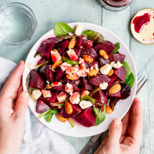 Plate of beetroot salad with sour cherry dressing