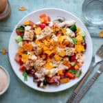 Mexican inspired salad topped with crushed Doritos