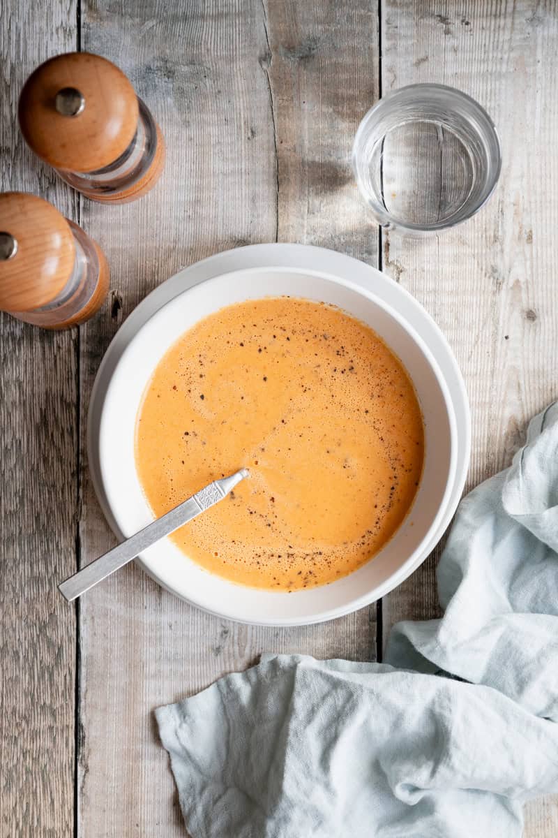 bowl of smooth vegan tomato and tahini soup